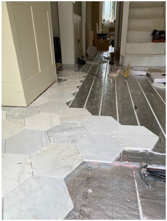 Underfloor heating and floor tiling installation